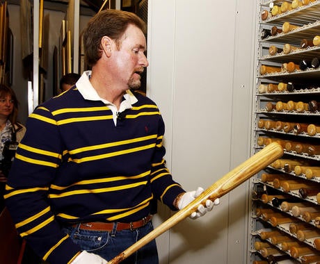 Wade Boggs holds the bat he used to hit the first home run in Tampa Bay Devil Rays history in 1998 while on his Hall of Fame Orientation Visit in May of 2005. (Milo Stewart Jr. / National Baseball Hall of Fame) 