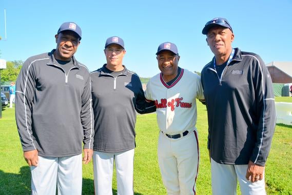 Hall of Famers Andre Dawson (left), Greg Maddux, Ozzie Smith and Ferguson Jenkins pose for a photo during the 14th annual PLAY Ball event Friday morning at Clark Sports Center in Cooperstown. PLAY Ball, which Smith has hosted since his Hall of Fame Induction in 2002, raised nearly $40,000 this year for the Museum's educational programs and  Frank and Peggy Steele Internship scholarships. (Ben Platt / MLB.com)