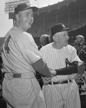Walter Alston, left, and Casey Stengel pose for photographers at Yankee Stadium. (Osvaldo Salas/National Baseball Hall of Fame and Museum)