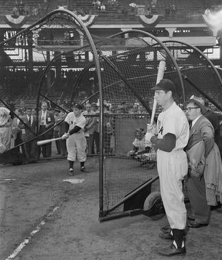 Joe DiMaggio watches as Yankees teammate Yogi Berra takes batting practice. (Osvaldo Salas/National Baseball Hall of Fame and Museum)