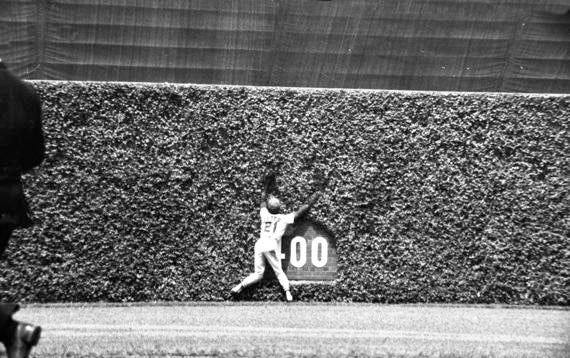 Some of the wholly unique aspects of “The Friendly Confines” include the old-fashioned scoreboard in center field, the proximity of fans to the field and the ivy-lined outfield walls that have given opposing players fits for decades. BL-1821-76-5 (National Baseball Hall of Fame Library)