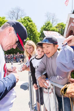 Hall of Fame pitcher Tom Glavine signs autographs for fans before the Hall of Fame Classic Game on May 23, 2015 in Cooperstown, NY. (Jean Fruth / National Baseball Hall of Fame)