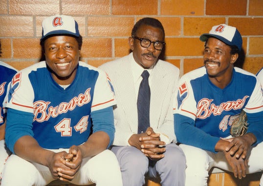 Ralph Garr, far right, with Hank Aaron and Satchel Paige in the Braves dugout at the Aug. 12, 1974, Hall of Fame Game at Doubleday Field. (National Baseball Hall of Fame and Museum)