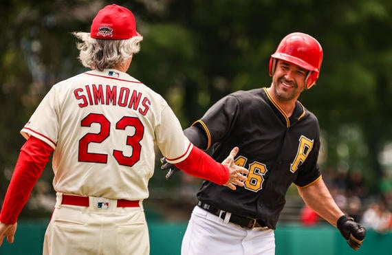 Garrett Jones is congratulated by Hall of Famer Ted Simmons after hitting one of his two home runs at the May 28 Hall of Fame Classic. (Parker Fish/National Baseball Hall of Fame and Museum)