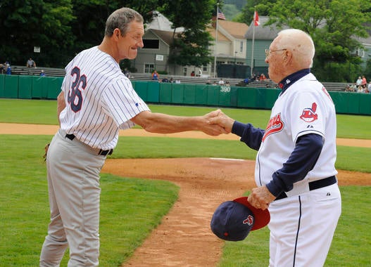 Jim Kaat shakes hands with Bob Feller at the 2009 Hall of Fame Classic at Doubleday Field in Cooperstown. (Milo Stewart Jr./National Baseball Hall of Fame and Museum)