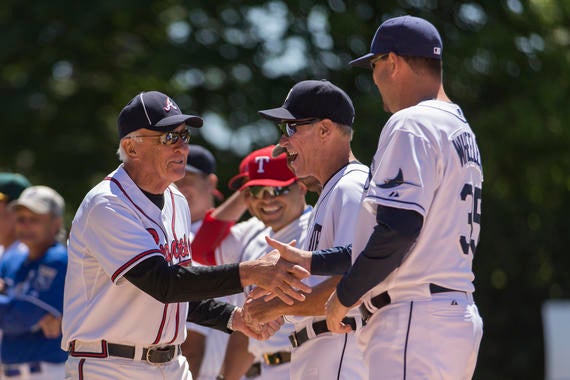 Phil Niekro (left) greets members of Team Knucksie, including Alan Trammell (center), before the 2015 Hall of Fame Classic Game in Cooperstown. (Jean Fruth/National Baseball Hall of Fame and Museum)
