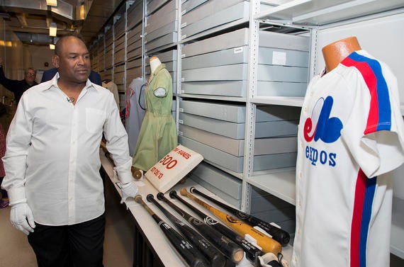Tim Raines checks out various artifacts preserved at the Hall of Fame, including former teammate Andre Dawson's Expos jersey. (Milo Stewart Jr. / National Baseball Hall of Fame and Museum) 