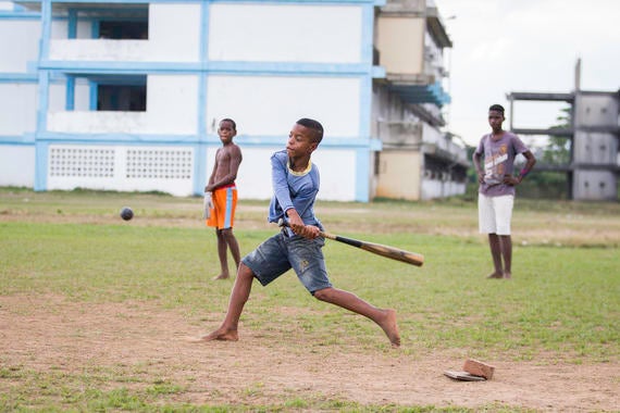 Kids play baseball in a field in Pinar del Rio on January 10, 2015 in Pinar De Rio, Cuba. (Jean Fruth / National Baseball Hall of Fame)
