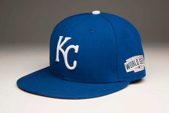 Brandon Finnegan made history wearing this Kansas City cap while pitching in Game Three, becoming the first player to take part in the College World Series and the MLB World Series in the same year. The 21-year-old induced two outs to hold a one-run lead in the Royals’ 3-2 victory, just four months after he was a starter for Texas Christian University. - B-177-2014 (Milo Stewart, Jr./National Baseball Hall of Fame Library)