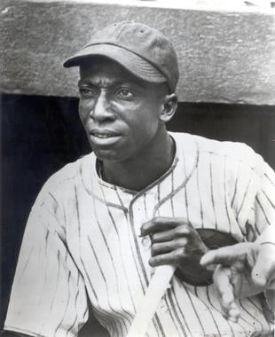 Cool Papa Bell photographed outside the dugout in an American Giants uniform. BL-3264.92 (National Baseball Hall of Fame Library)