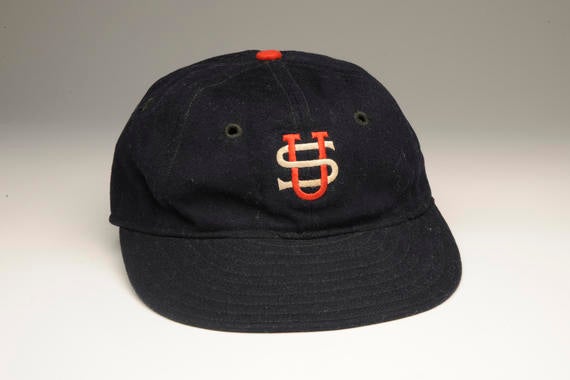This baseball cap was worn during the 1934 tour of Japan by the American club's back-up catcher, Moe Berg. The Princeton-educated Berg, who played in just a third of the games that took place during the tour, was enthralled by his experience in the Orient. - B-139-78 (Milo Stewart, Jr./National Baseball Hall of Fame Library)