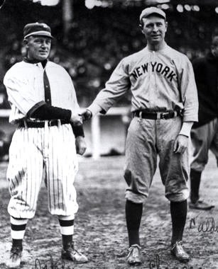 Bill Dahlen, left, shaking hands with New York Yankees third baseman (and HOFer) Frank Chance. BL-6572.92 (National Baseball Hall of Fame Library)