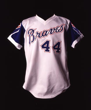 Atlanta Braves home uniform shirt #44 worn by Hank Aaron on April 8, 1974 when he broke Babe Ruth's career home run record with his 715th homer in the 4th inning vs. Los Angeles Dodgers - B-5.87  (Milo Stewart Jr./National Baseball Hall of Fame Library)