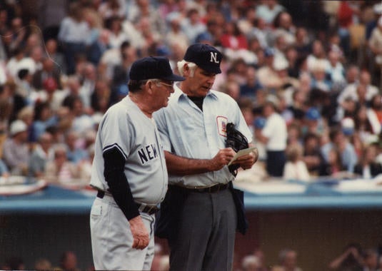 Umpire Doug Harvey with New York Yankees manager Bob Lemon in Game Four of the World Series, October 25, 1981 - BL-3483-2005-55 (National Baseball Hall of Fame Library)