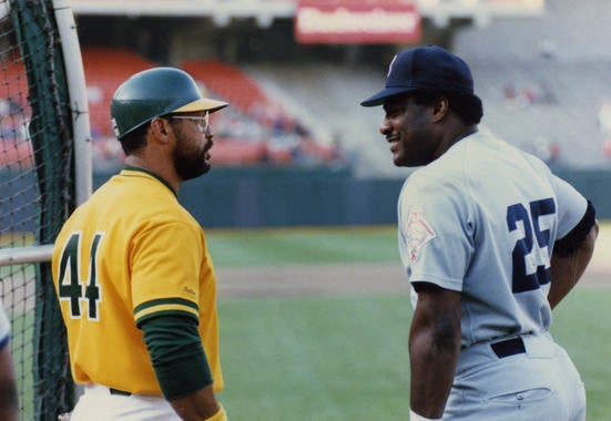 Oakland's Reggie Jackson (left) and Boston's Don Baylor, in Oakland, 1987  - BL-McWilliams 099  (Doug McWilliams/National Baseball Hall of Fame Library)