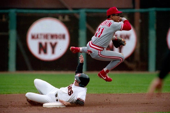 Barry Larkin of the Cincinnati Reds turns a double play at second base during a game against the San Francisco Giants at Candlestick Park in San Francisco, California in 1990. (Brad Mangin/National Baseball Hall of Fame Library)