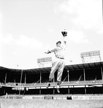 Marion stretches to catch the ball during a 1945 photo shoot. BL-251.54.28 (Look Magazine Collection / National Baseball Hall of Fame Library)