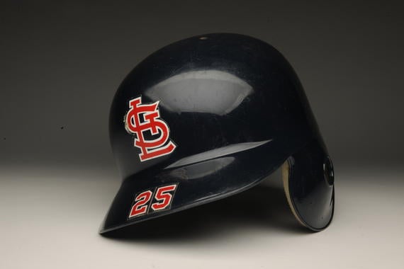 Road batting helmet used by Mark McGwire of the St. Louis Cardinals during the 1998 season, during which time he amassed a MLB record-setting 70 home runs. B-302.98 (Milo Stewart, Jr. / National Baseball Hall of Fame)