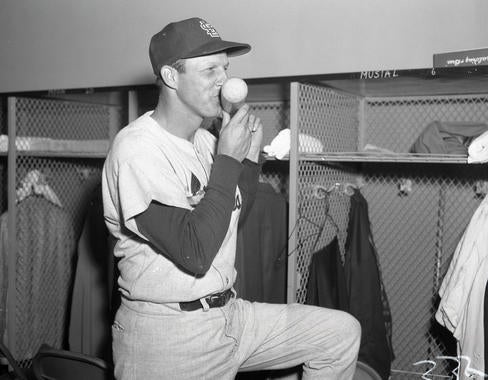 Stan Musial kisses the bat he used to collect his 3,000th career base hit, as a pinch-hitter against the Cubs on May 13, 1958. BL-77-58a (National Baseball Hall of Fame Library)