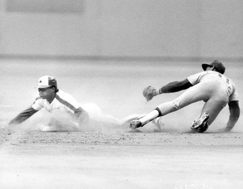 Tim Raines of the Montreal Expos sliding in safely after stealing a base. BL-1472.2002 (National Baseball Hall of Fame Library)