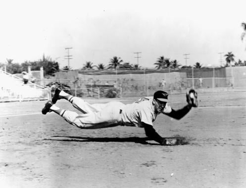 Brooks Robinson of the Baltimore Orioles makes a diving stop - BL-1022-64 (National Baseball Hall of Fame Library)