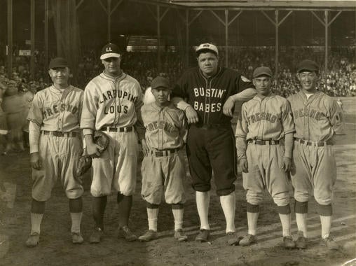 Babe Ruth and Lou Gehrig on a barnstorming tour following the 1927 World Series posed with members of the Fresno Athletic Club team at Firemen’s Park, in Fresno, California on October 29, 1927. BL-5487-88 (Frank Kamiyama / National Baseball Hall of Fame Library)