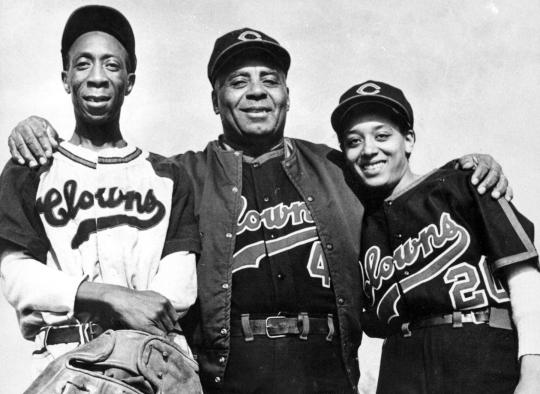 Former Negro League and current National League players stand