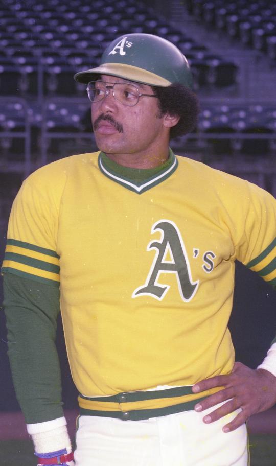 Reggie Jackson waves during a celebration of the Oakland Athletics' 1972  World Series winning team before a baseball game between the Athletics and  the Boston Red Sox in Oakland, Calif., Saturday, June