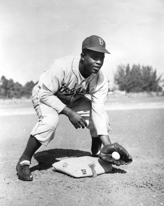 Dodger second baseman Jackie Robinson becomes the first black