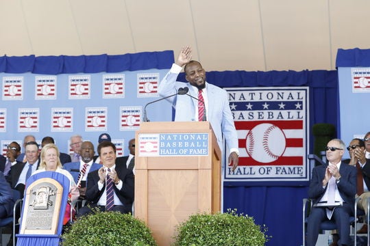 Vladimir Guerrero waves to the crowd after delivering his Induction Speech. Many fans traveled from the Dominican Republic to see the Dominican-born Guerrero. (Milo Stewart Jr./National Baseball Hall of Fame and Museum)