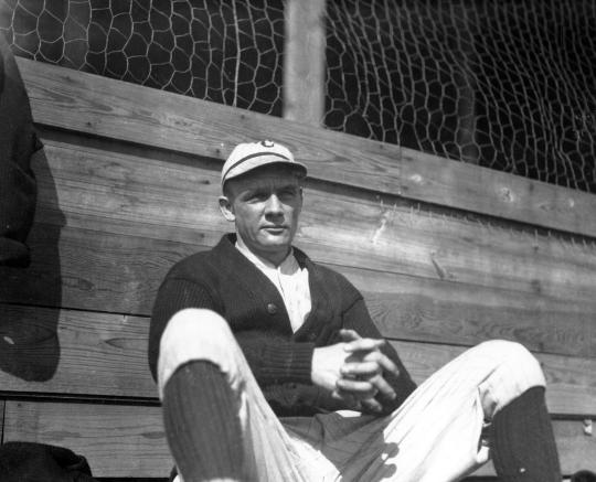 Nap Lajoie of the Cleveland Naps standing on the field with his bat during  practice 1903