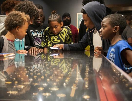 Kids looking at the World Series Ring case in Autumn Glory exhibit